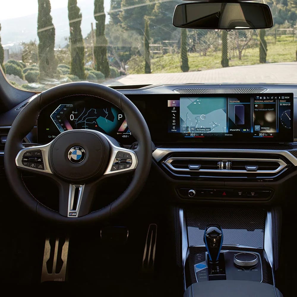 A driver's eye view of steering wheel and controls of the BMW i4 | BMW of Bloomfield Hills in Bloomfield Hills MI