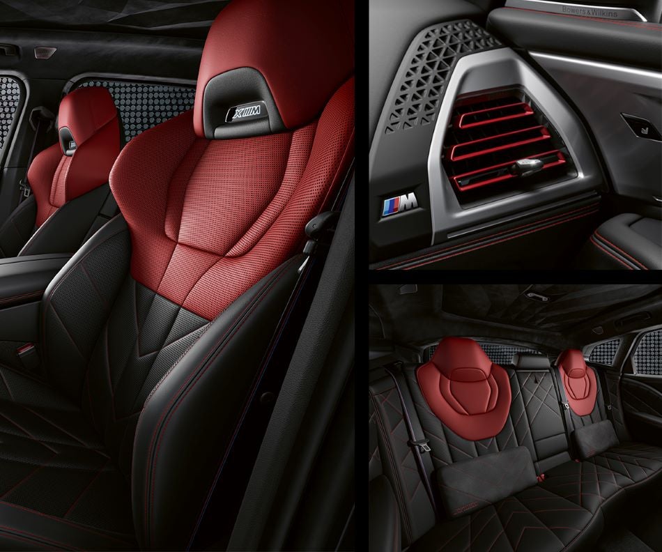 Detail of front seats, clad in exclusive BMW Individual Fiona Red & Black Merino Leather with exclusive M Signature Trim and red stitching and accents. Detail of red accented vent. Detail of rear M Lounge with exclusive XM pillows in BMW of Bloomfield Hills | Bloomfield Hills MI